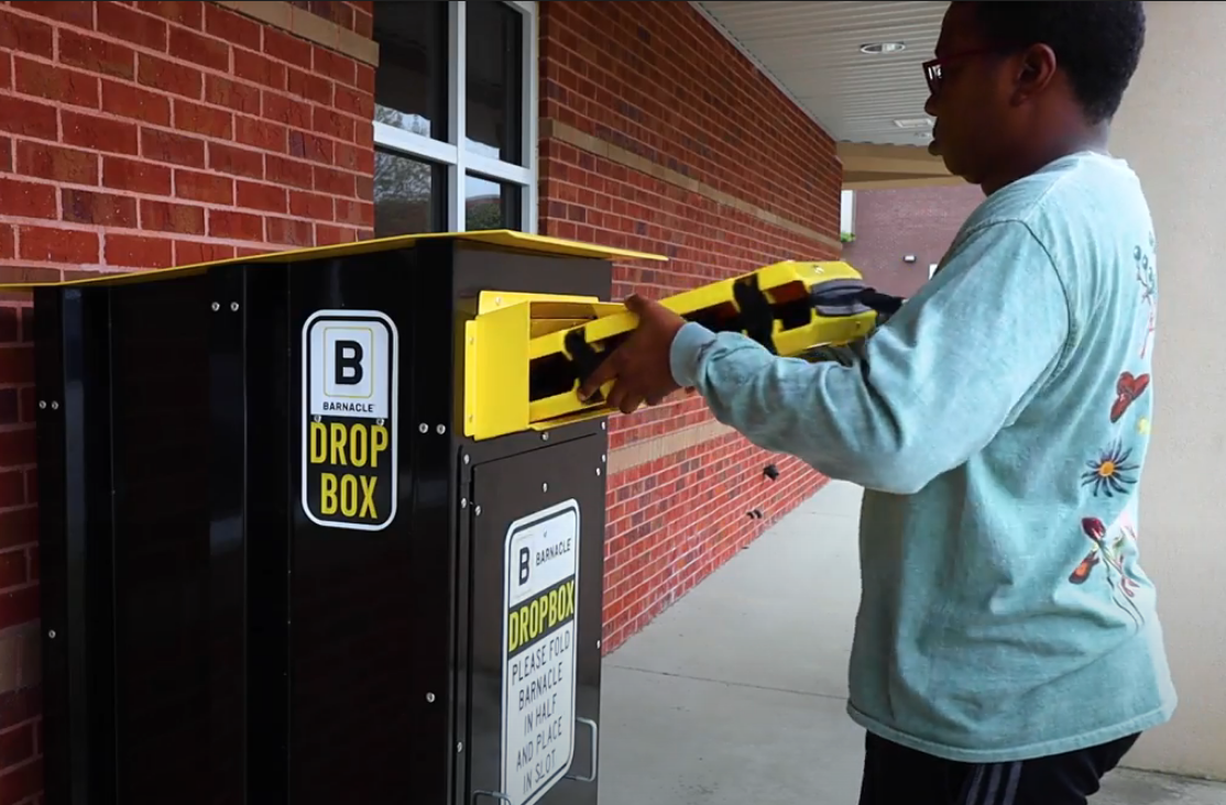 Owner of vehicle returning barnacle tool to drop box.