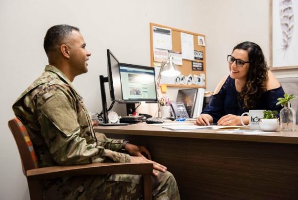 Two people discussing new military experience
