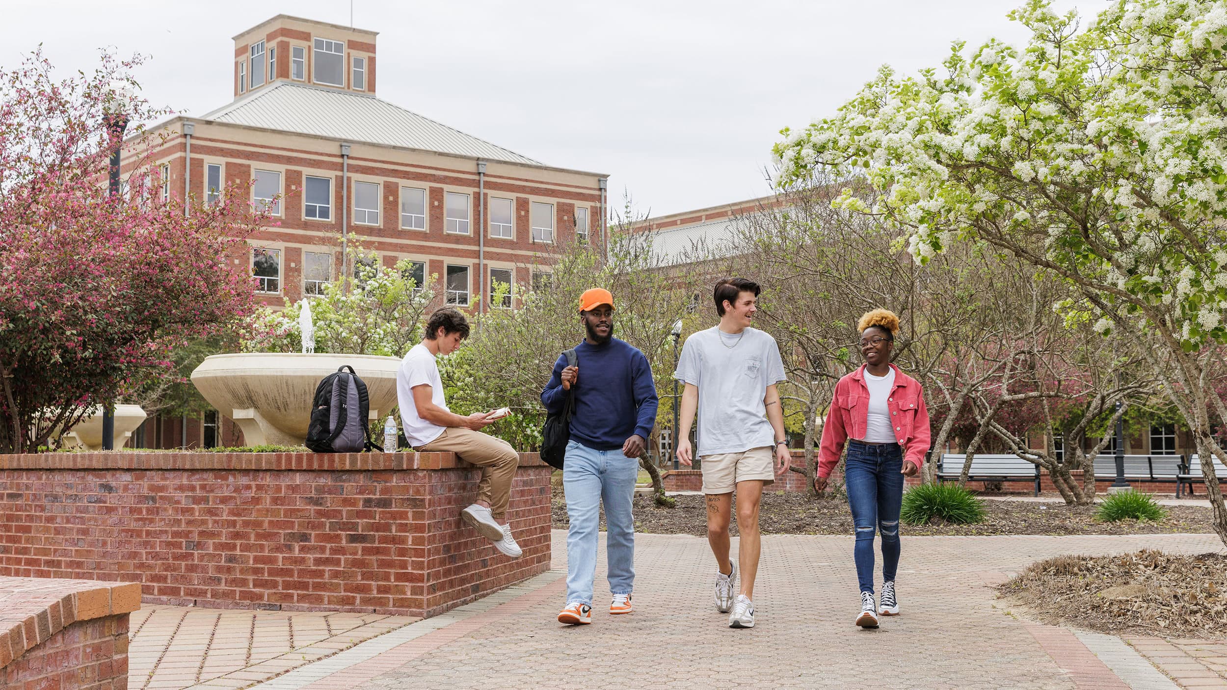 Georgia Southern students stroll across the beautiful campus next to the fountain.