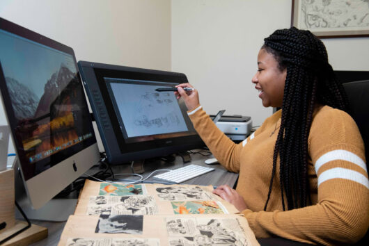 A Georgia Southern BA in History student works with mixed media on a history project.