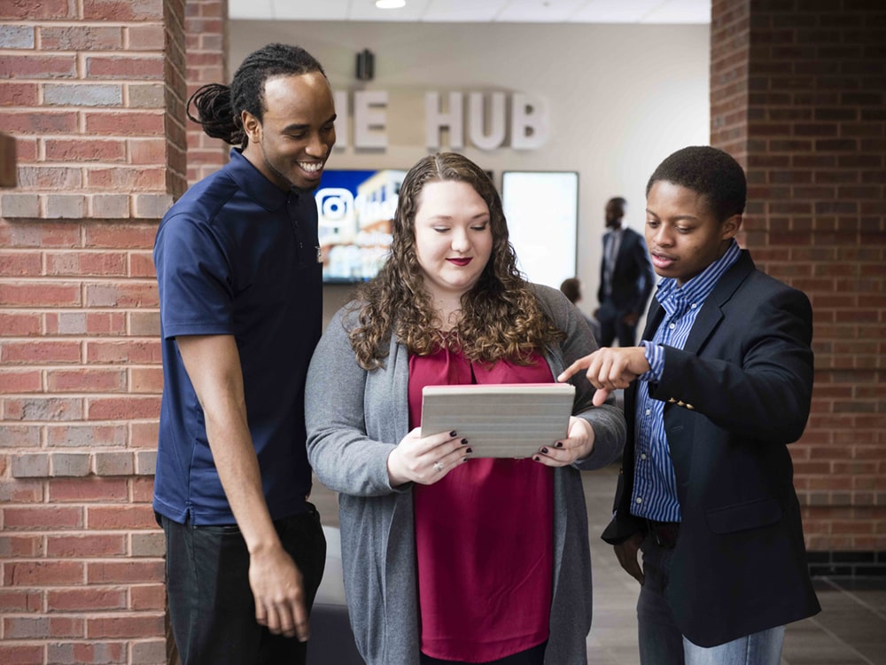 A group of Georgia Southern political science students comment prepare for a speech together.