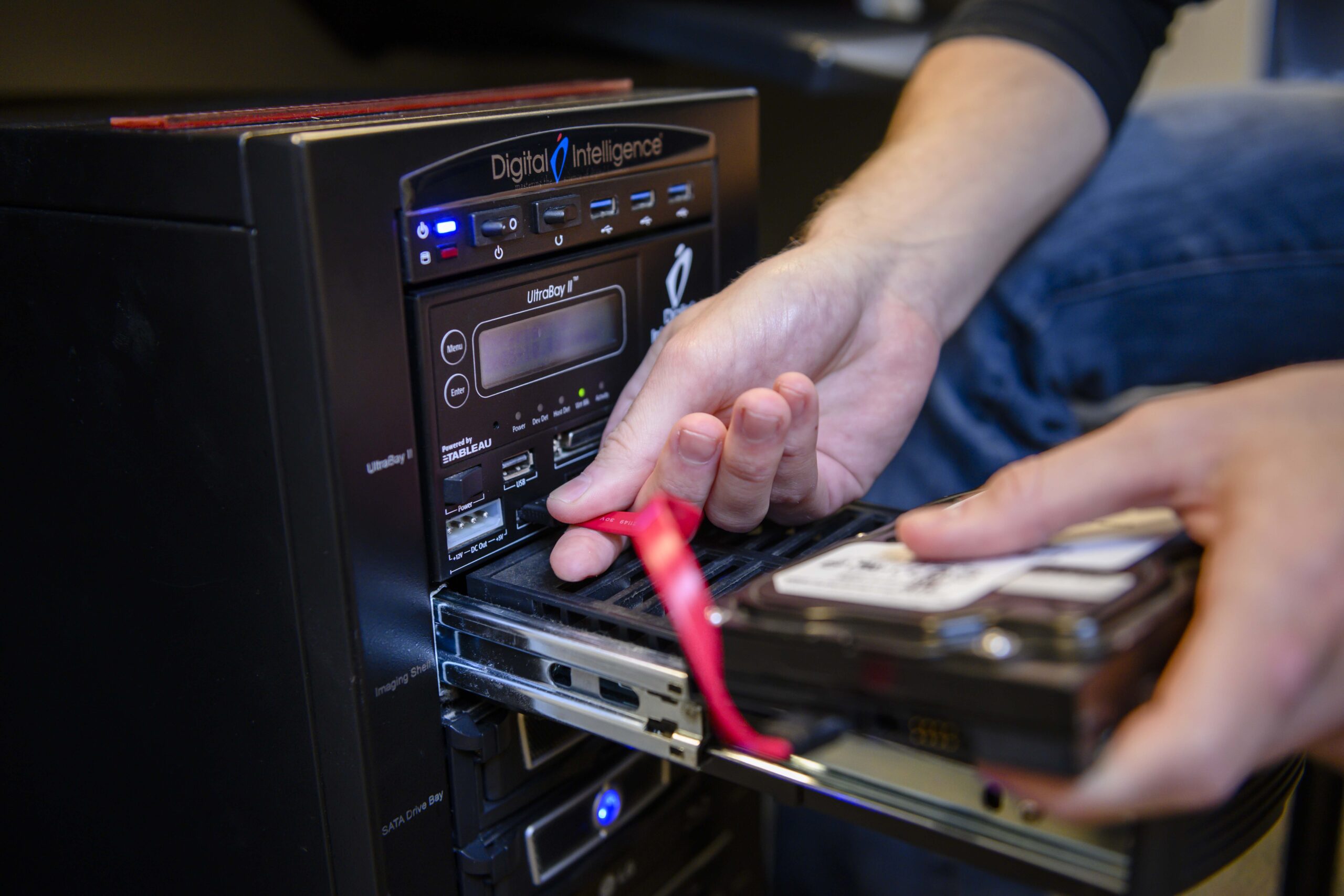 Georgia Southern student in hands-on technology training, practical application of security tech investigation