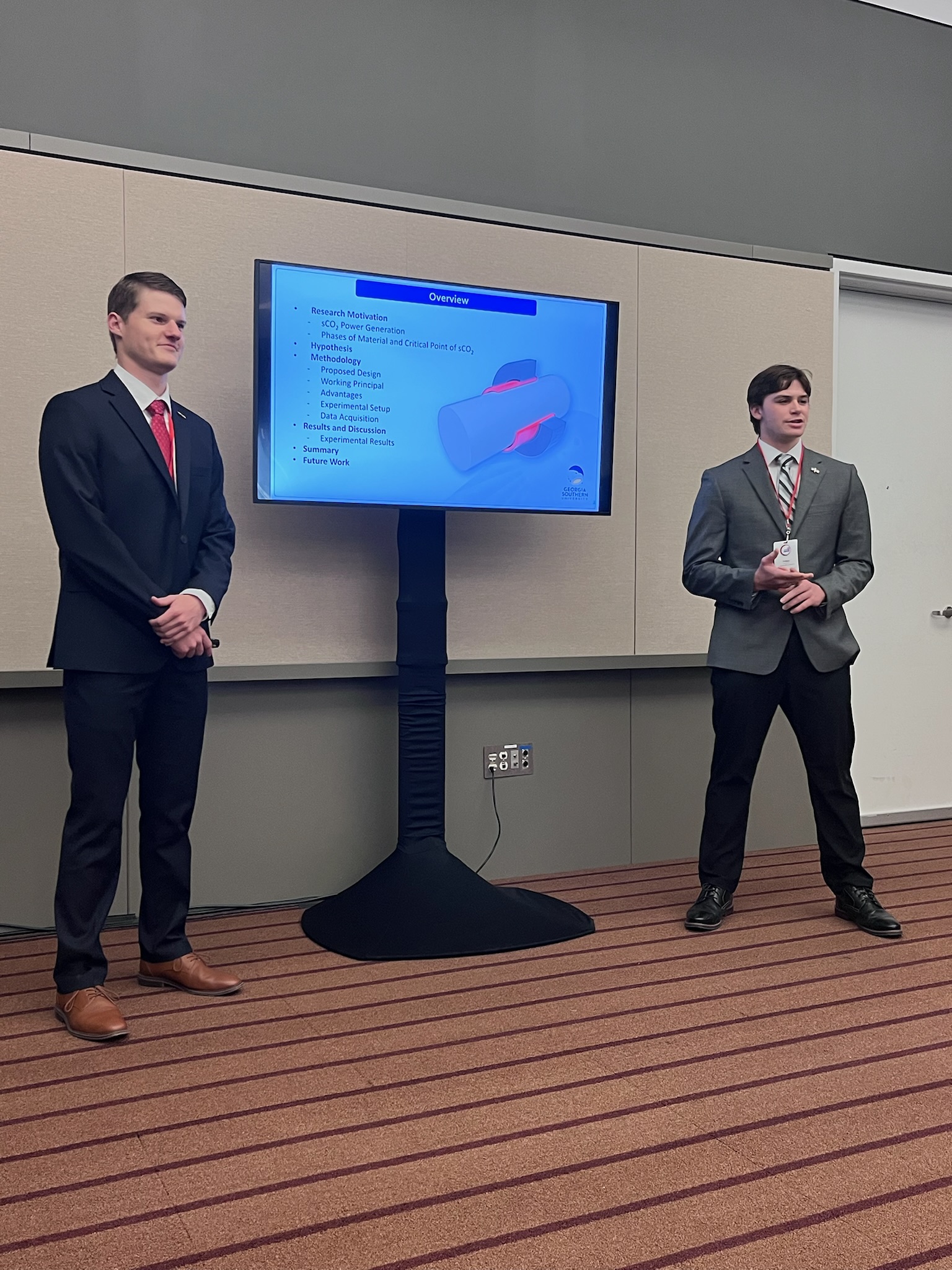 Brenton Hall and Tyrus Carter present their research.