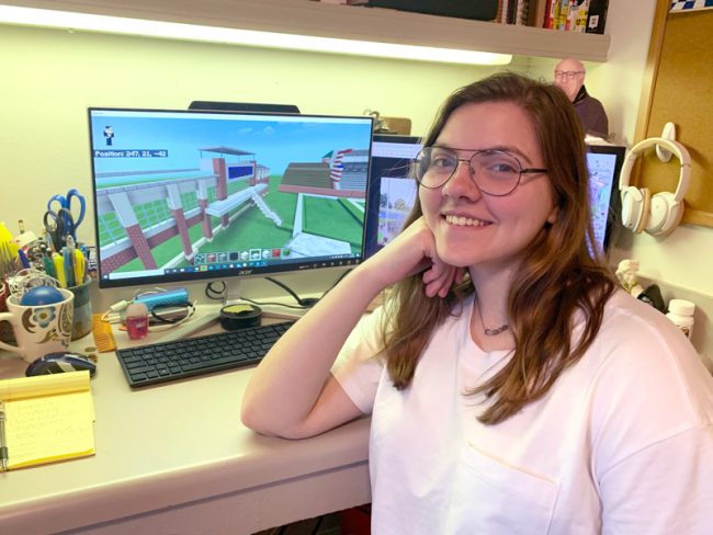 Rebecca Hooper building Paulson on her computer