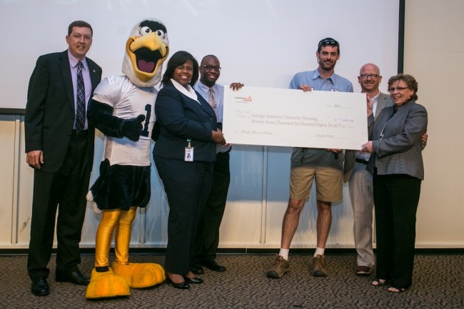 Representatives from Georgia Power present a rebate check to Georgia Southern University's Housing department on Wednesday, June18. The rebate was a result of the Commercial Energy Efficiency Program, an initiative to help companies reduce energy use and costs. From left: Eddie Mills, associate vice president of Auxiliary Services; GUS; Tan Adams, Georgia Power area manager; Jamarcus Brewer, coastal region account manager of ICF International; Jesse Hopkins, electrical supervisor; Chris MacDonald, executive director of University Housing and Elke Dennis, procurement specialist. 